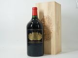 a bottle of wine sitting next to a wooden box