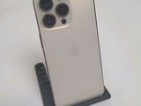 an iphone 11 pro with a camera attached to the back of it