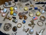 a table with many different types of jewelry on it