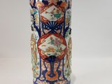 a vase with a design on it on a white surface