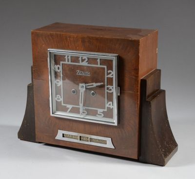 a wooden clock that is sitting on a table