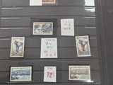 a picture of a collection of stamps on display in a glass case