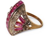 a close up of a pink and gold ring with diamonds