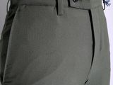 the back view of a woman ' s pants with buttons on the waist