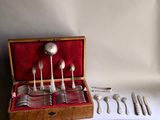 a box with silverware in it on a table