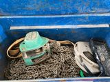 a blue box with chains and a helmet in it
