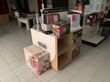 a counter with a microwave, microwave oven, and other items on it