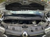 a car that has its hood open on the road