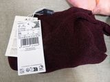 a person that is holding a bag with a price tag on it