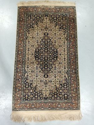 an antique persian rug on a white background