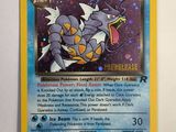 a close up of a pokemon card on a white surface