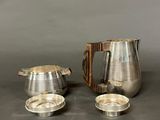 two pieces of silverware sitting on top of a table
