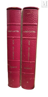 une paire de livres en cuir rouge, chacun orné d'une inscription dorée