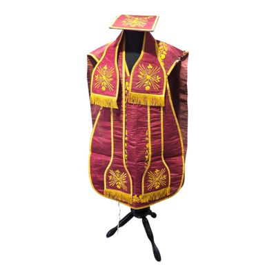 an image of a vest with a gold and red design on it