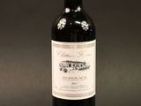a bottle of wine that is sitting on a table