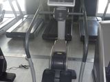 a tread machine in the middle of a gym room