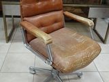 a chair that is sitting in a room with tile flooring