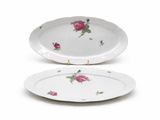 two white plates with pink roses on them on a white surface