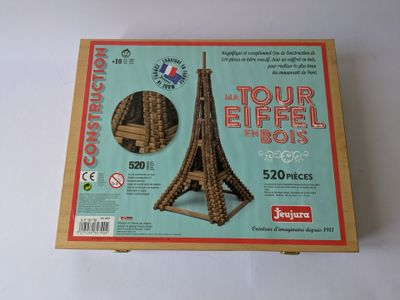 a cardboard box with a picture of the eiffel tower in it