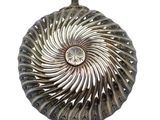a metal object with a spiral design on it