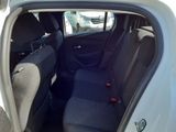 the back seat of a white car with a black seat belt
