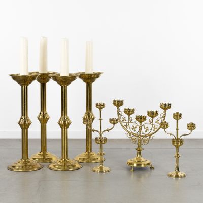 brass candlesticks and candelabs in various sizes and shapes