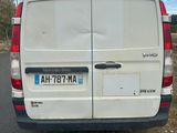 a white van that is parked on the side of the road
