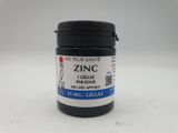 a close up of a jar of paint on a white surface