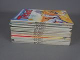 several books stacked on top of each other on a table