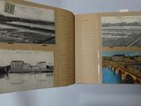 an open book with pictures of a bridge and buildings on it