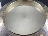 a silver plate that is sitting on top of a table