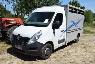 a white van that is parked in the dirt