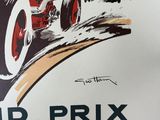 a poster of a vintage race car driving down the road