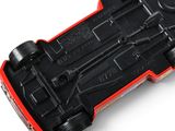 a close up of a remote control car on a white surface