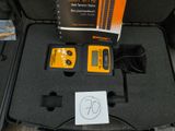 a black case with a yellow and black device in it