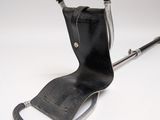 a black leather seat with a handle and a metal handle