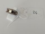a couple of rings sitting on top of a white table