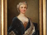 a painting of a woman in a blue dress with a gold frame