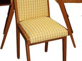 a chair that is sitting next to a desk with a chair on it