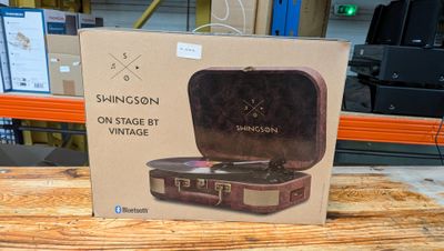 a cardboard box with a picture of a record player inside of it
