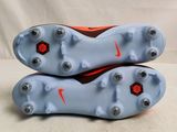 the soles of a pair of soccer shoes on a white background