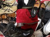 many pairs of shoes that are sitting in a basket