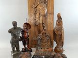 a statue of jesus on a pedestal with other statues