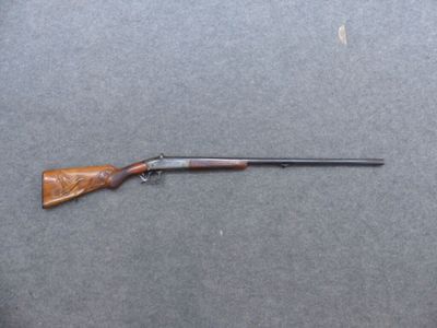 a rifle that is laying on top of a table