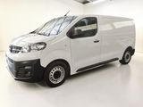 a picture of a white van parked in a garage