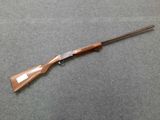 a rifle that is laying on a table