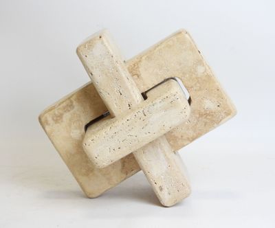 cement sculpture of a cross on a white background