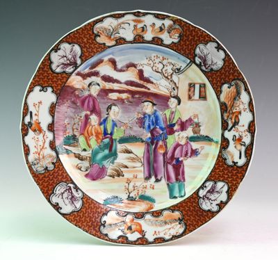a plate with a picture of a man and a woman on it