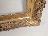 a picture of a picture of a gold frame on the wall
