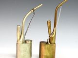 two metal objects that are sitting next to each other